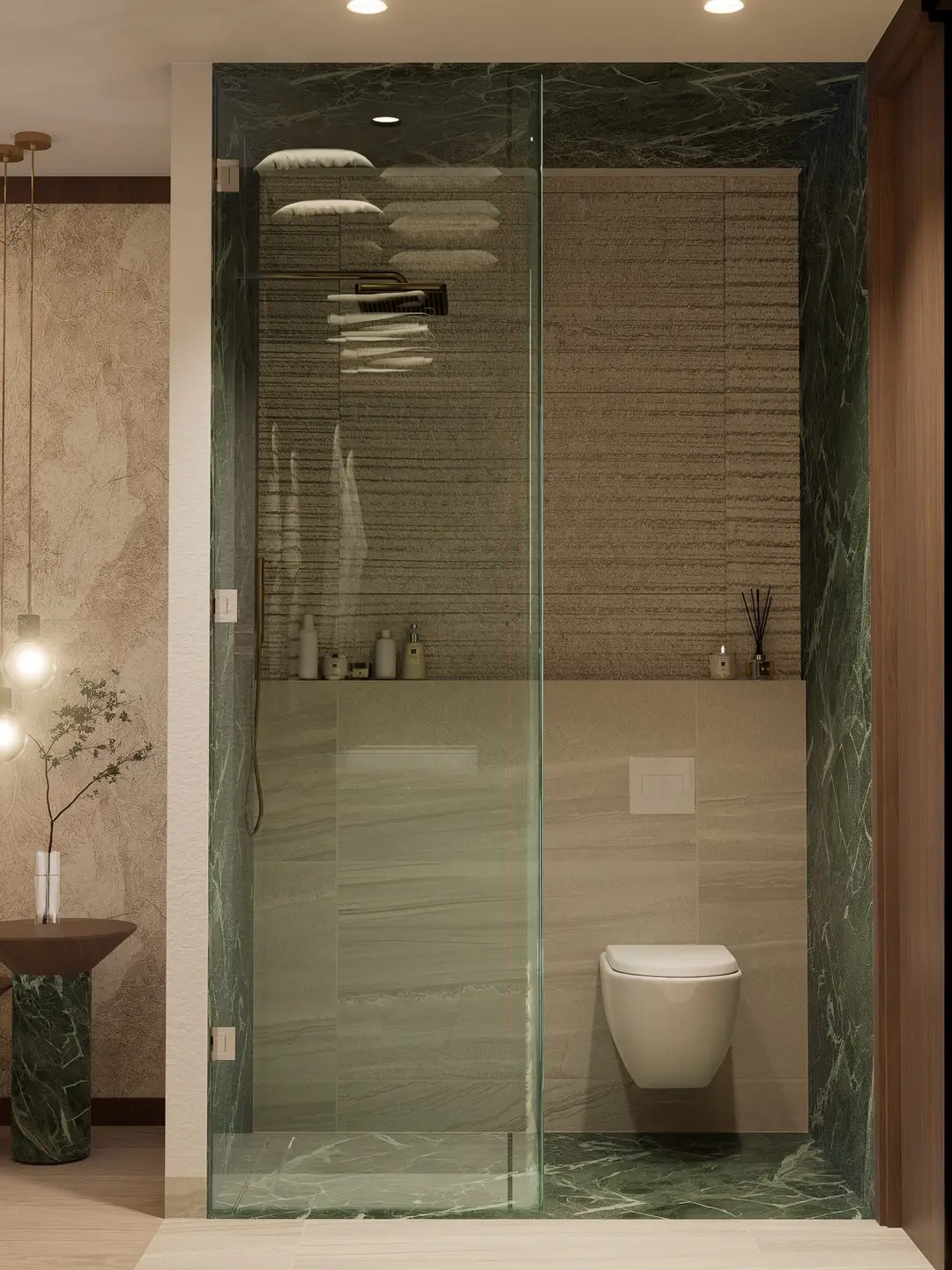 Baño con regadera revestida en mármol verde y cancel de cristal